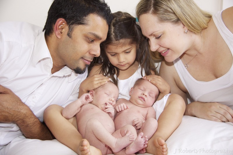 Family adoring newborn twins - baby portrait photography sydney